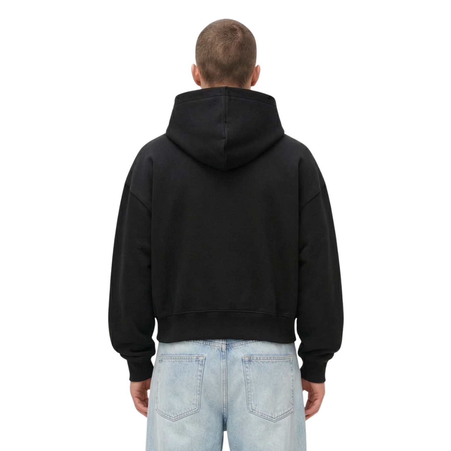 Person wearing a black hoodie from behind on a white background