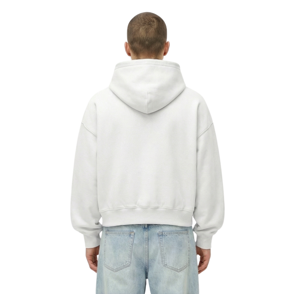 Person wearing a white hoodie and light blue jeans on a white background