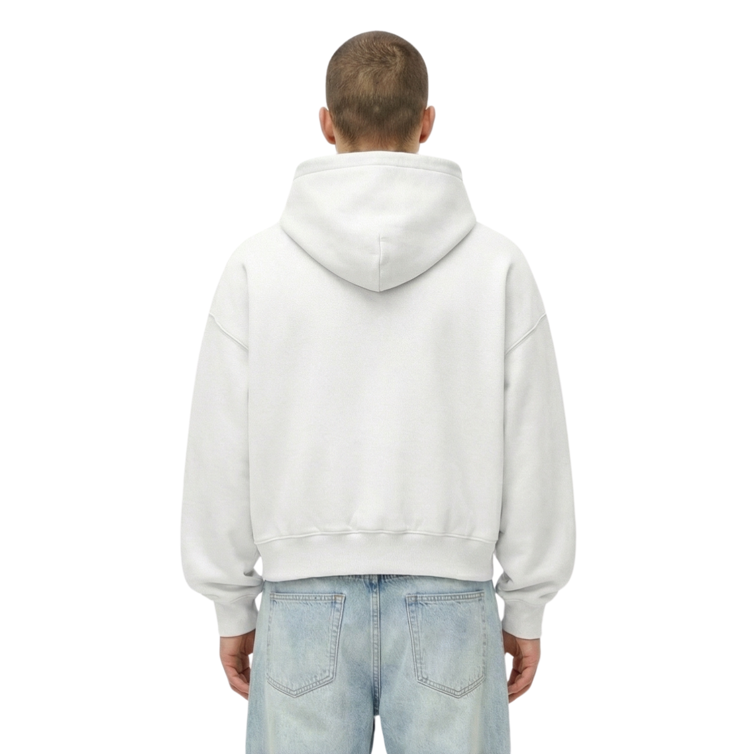 Person wearing a white hoodie and light blue jeans on a white background